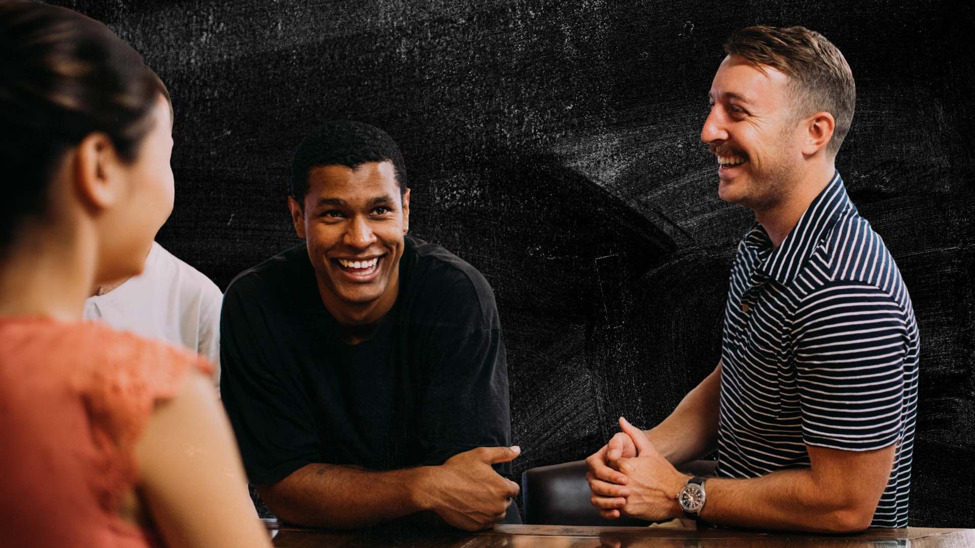 Stylised photo of joyful-looking people, smiling and laughing.